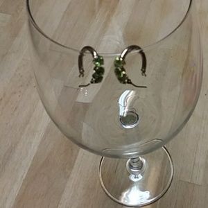 14kt Gold hoops with emerald green gemstones.